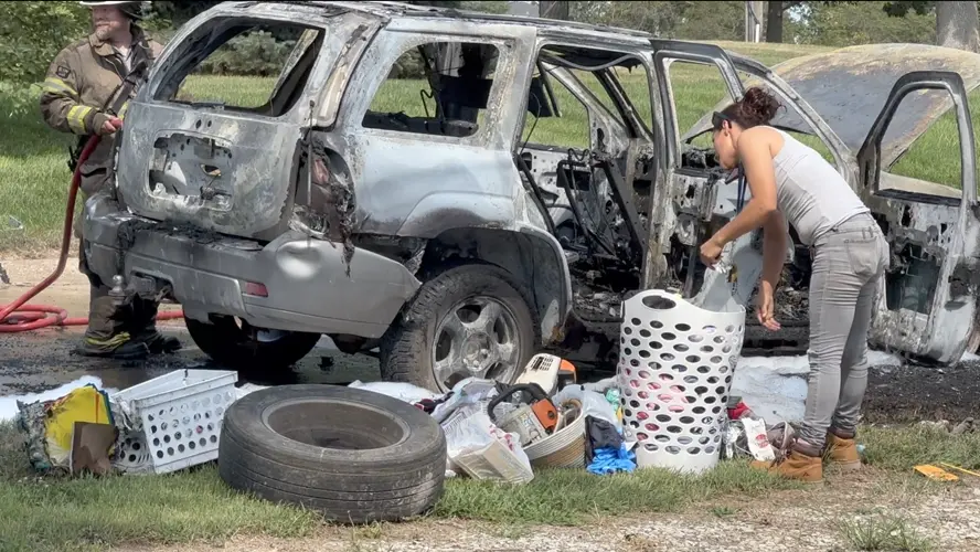 Auburn woman pulls belongings from burning car