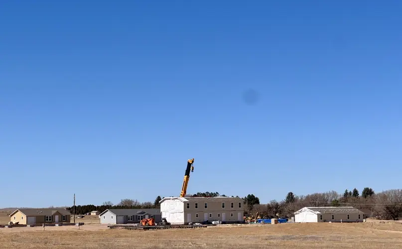 Clean Harbors' Light House Subdivision moves forward as apartment buildings are moved onsite