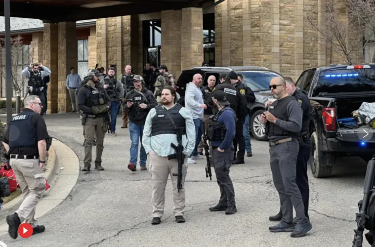 Armed man rammed vehicle into Michigan synagogue and was fatally shot by security, AP source says