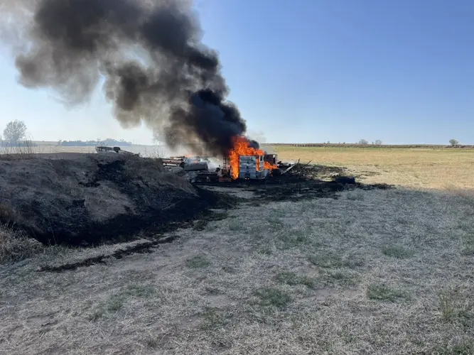 Fire from unattended burn spreads to debris piles near Sterling