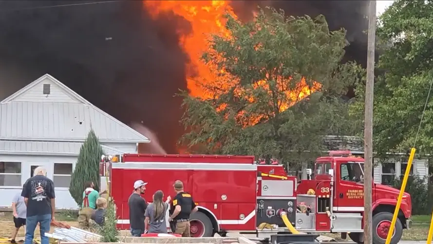 Crews protect nearby homes as raging Fairbury house fire destroys property