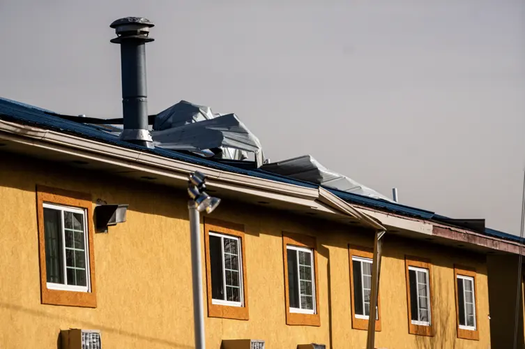 High winds tear roofing from downtown Sidney motel, city issues safety warning