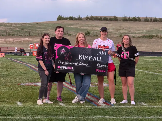 T-Mobile representatives present $5K check to Kimball High School