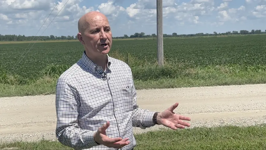 Ricketts tours river levee at Peru