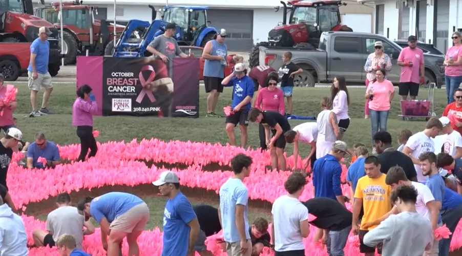 Thousands of pink flags create giant ribbon in Kearney for breast cancer awareness