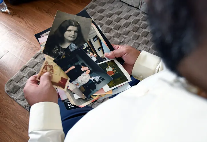 A man whose mother was found among 189 decaying bodies tells the story