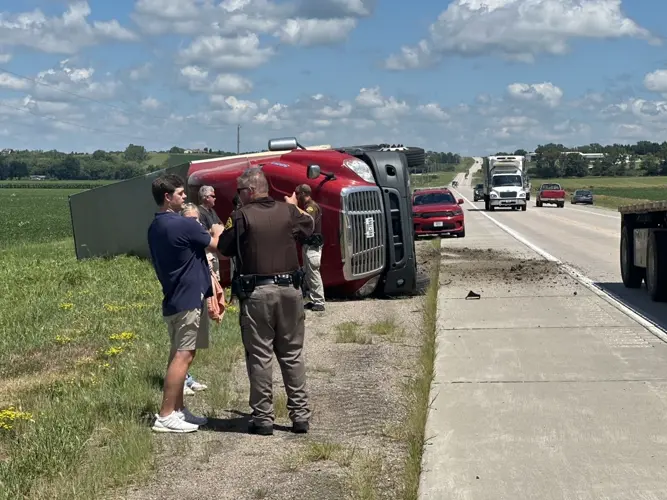 Truck overturns after evading traffic